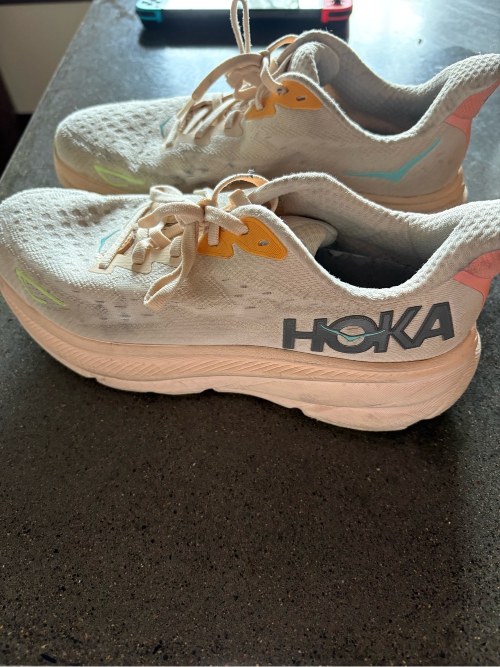 Hoka Cream Athletic Running Shoes with Yellow and Teal Accents